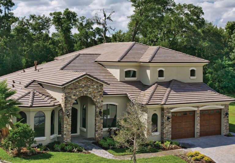 Bel Air Roof Single-storey Mediterranean home with light tan clay roof tiles and arched entry.